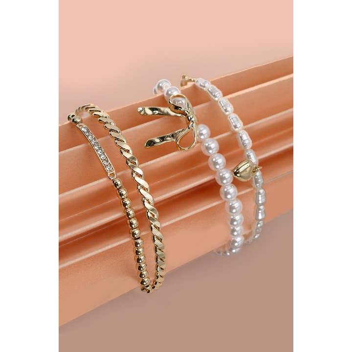 GOLD BOW PEARL RHINESTONE BAR STRETCH BANGLE SET | 80B137 for wholesale on Faire