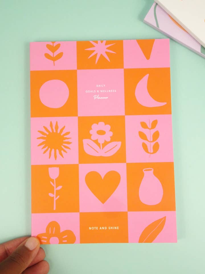 Daily Goals and Wellness Planner (Checkered Pink and Orange) for wholesale by Note and Shine