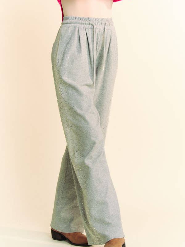Grigio PANTALONI LUNGHI IN FELPA CON ELASTICO IN VITA CON STRASS in vendita all'ingrosso su Faire