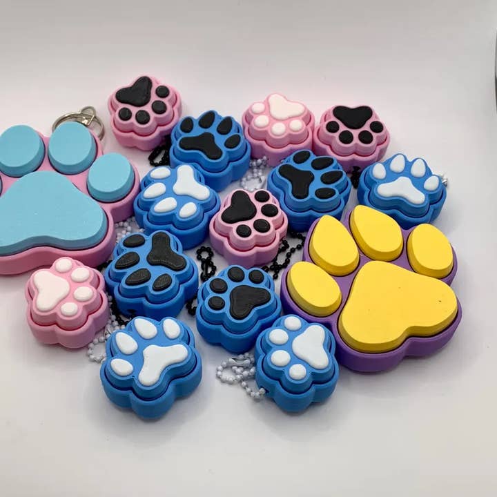 Rondom Color Dog & Cat Paw Print Fidget Clickers - 3D Printed Keychain for wholesale on Faire1