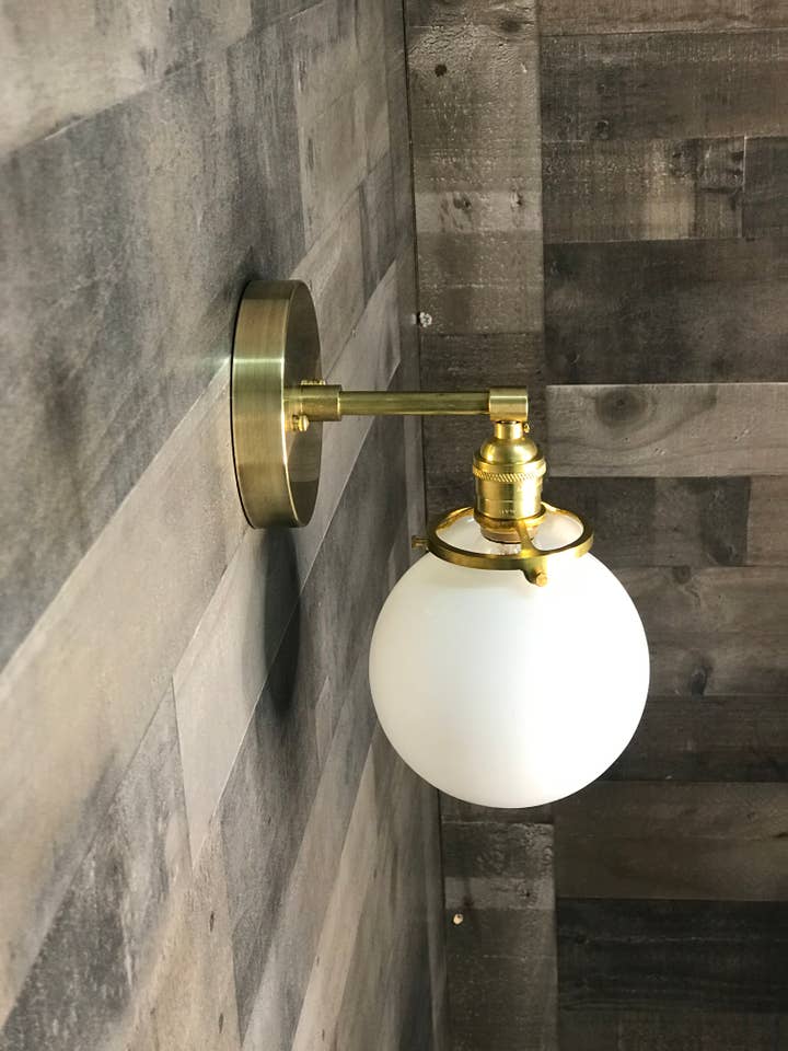 Ambedo 6" Globe Mid Century Vanity Sconce for wholesale by Lustrous Lumens