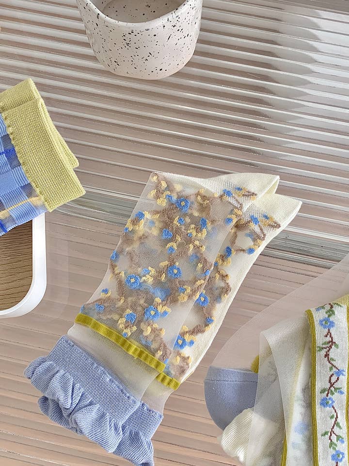 Sheer socks with blue flowers 💙🌼 for wholesale on Faire6