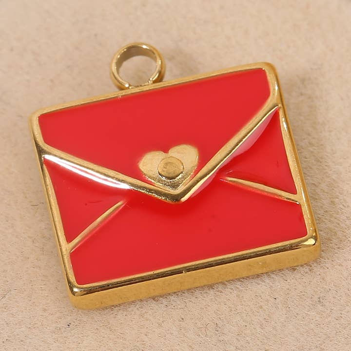 Set med 3 guldpläterade hängen med röd hartsomslag för wholesale av JOYA