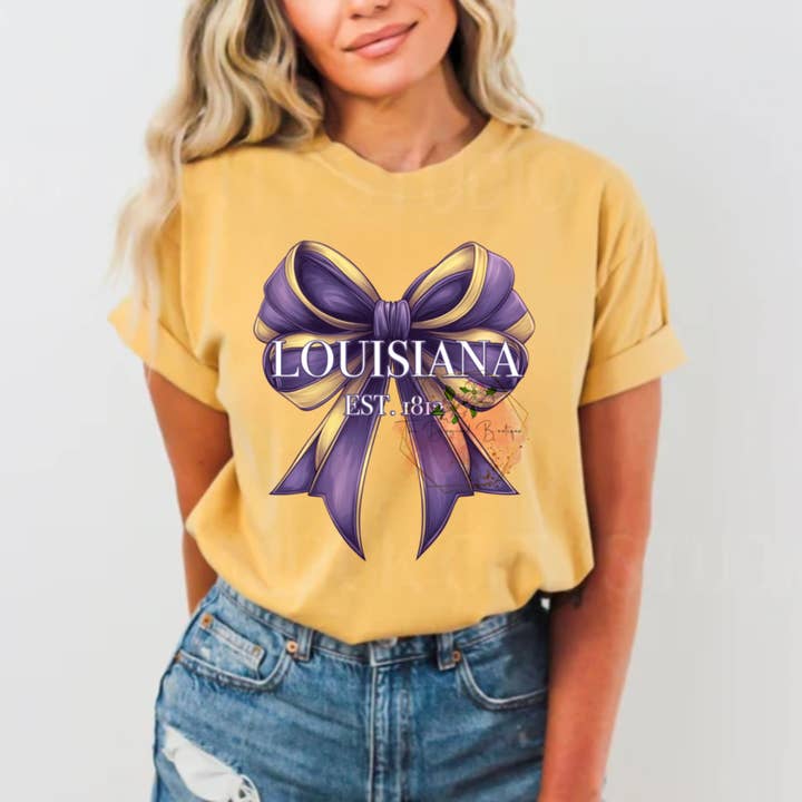 Louisiana Purple & Gold Coquette Comfort Colors Tee for wholesale by Dogwood Designs