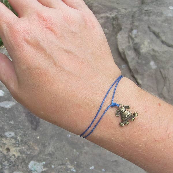 Dog with a Bone Thread Bracelet for wholesale by Dog Park Publishing