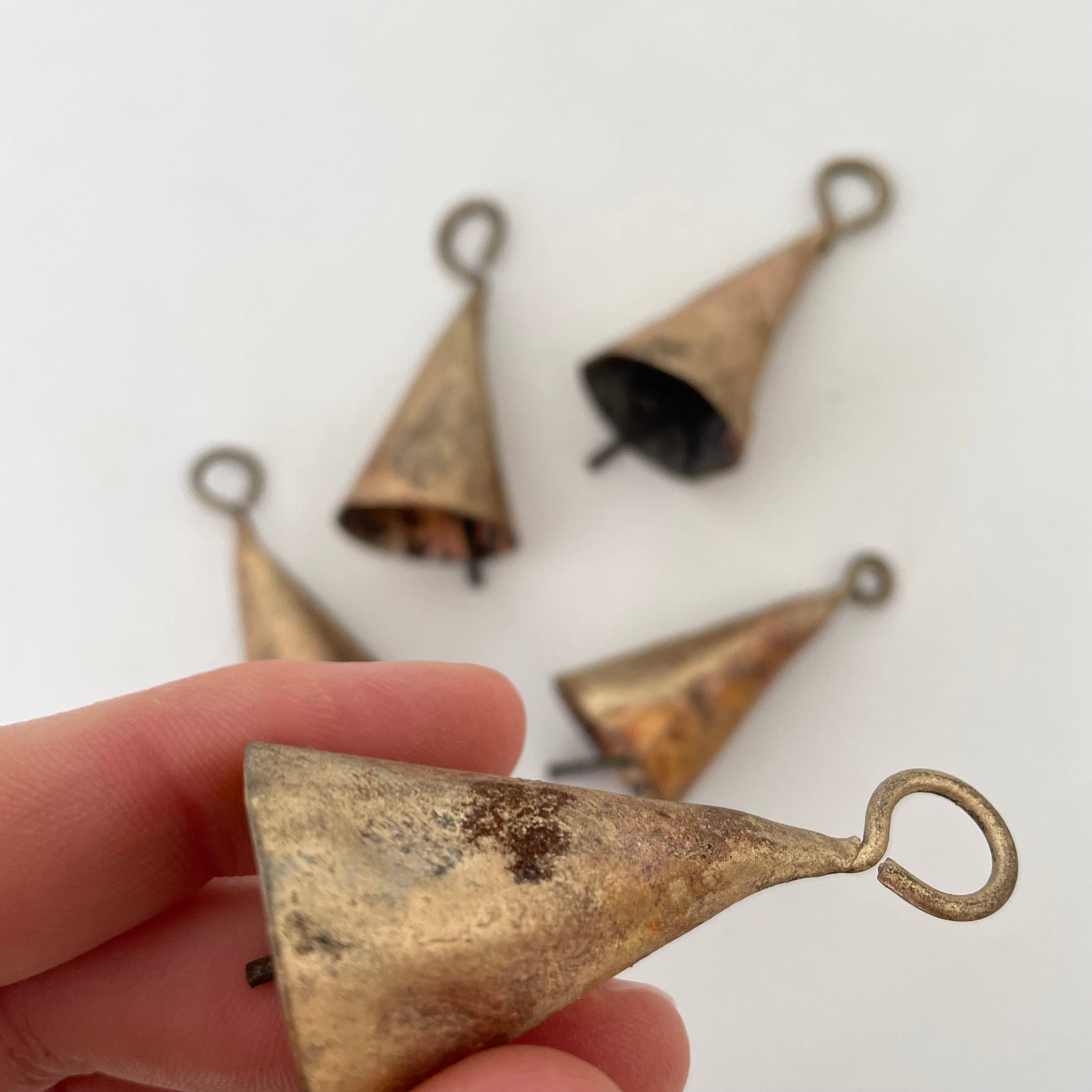 fort & field – wholesale Bunting/garland – Rustic tin cone shaped brass bell jute holiday garland5