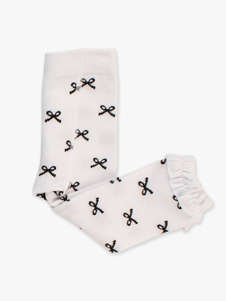 Collants sans pieds à volants à motif nœuds noirs pour filles pour la vente par RuffleButts + RuggedButts