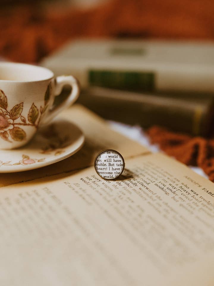 Bookish Ring | Bible (I have overcome the world) for wholesale by The Authored Shop
