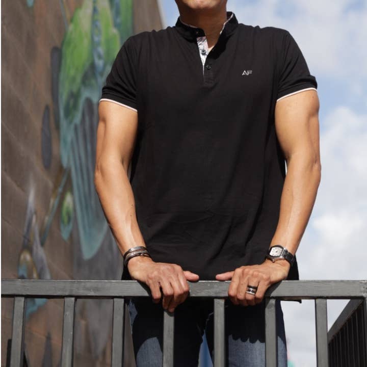 Polo preto clássico por atacado de Andrea Febres