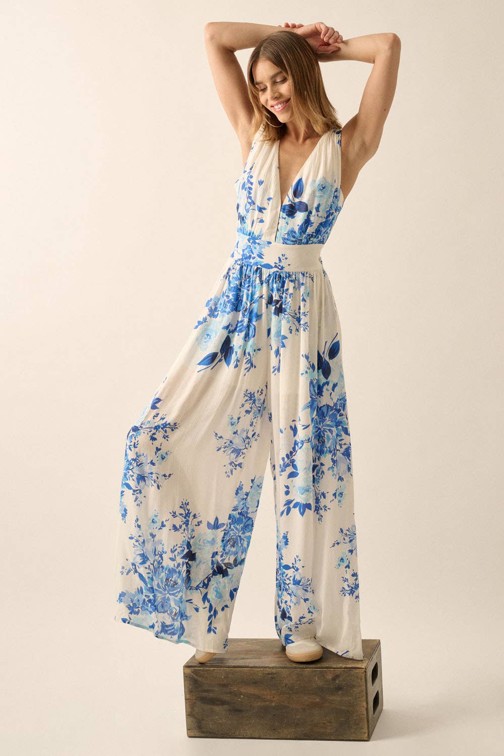 Off White Blue Plunging Neck Floral Woven Jumpsuit for wholesale on Faire7
