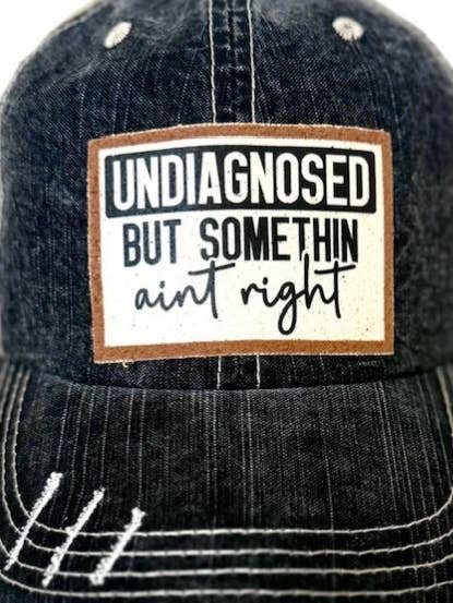 UNDIAGNOSED BUT SOMETHING AINT " DISTRESSED TRUCKER HAT #315 for wholesale by Jana's Flannels