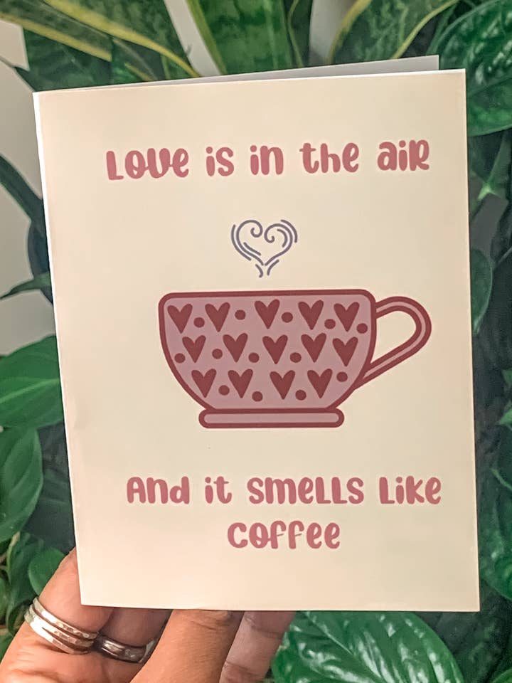 Tarjeta de felicitación Love is in the Air, diseño Coffee Humor, para San Valentín para venta al por mayor de WanderlustBee
