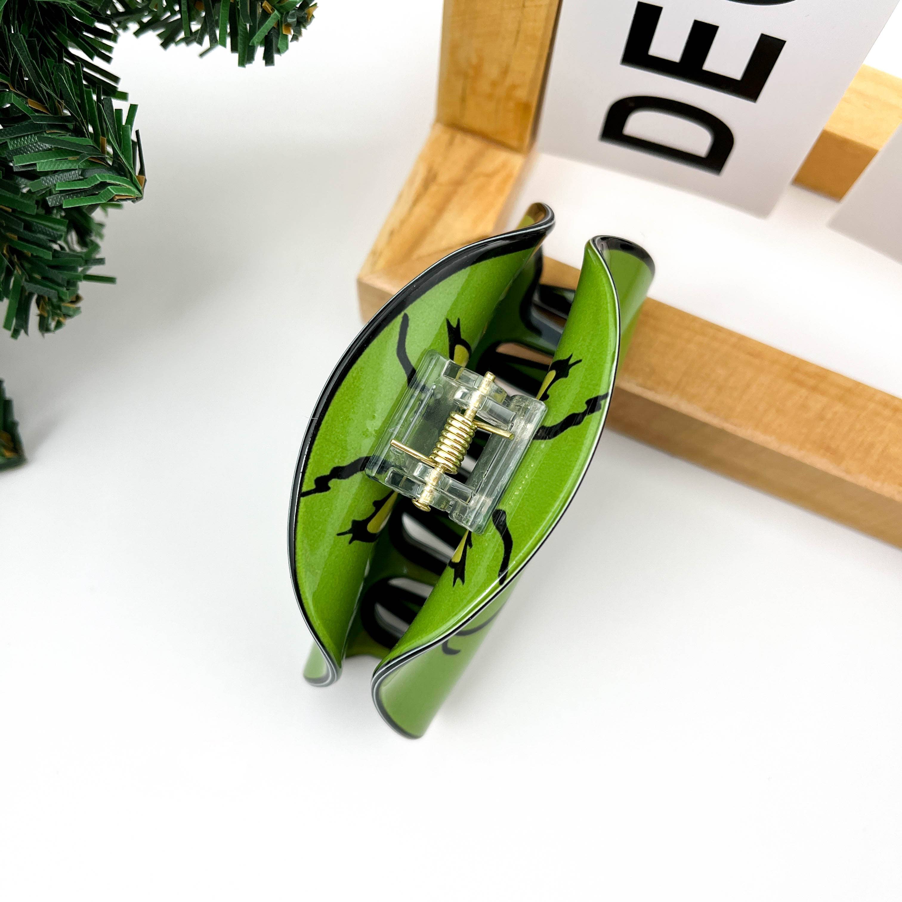 Groen Green Goblin gezicht haarclip met klauw voor groothandel op Faire4