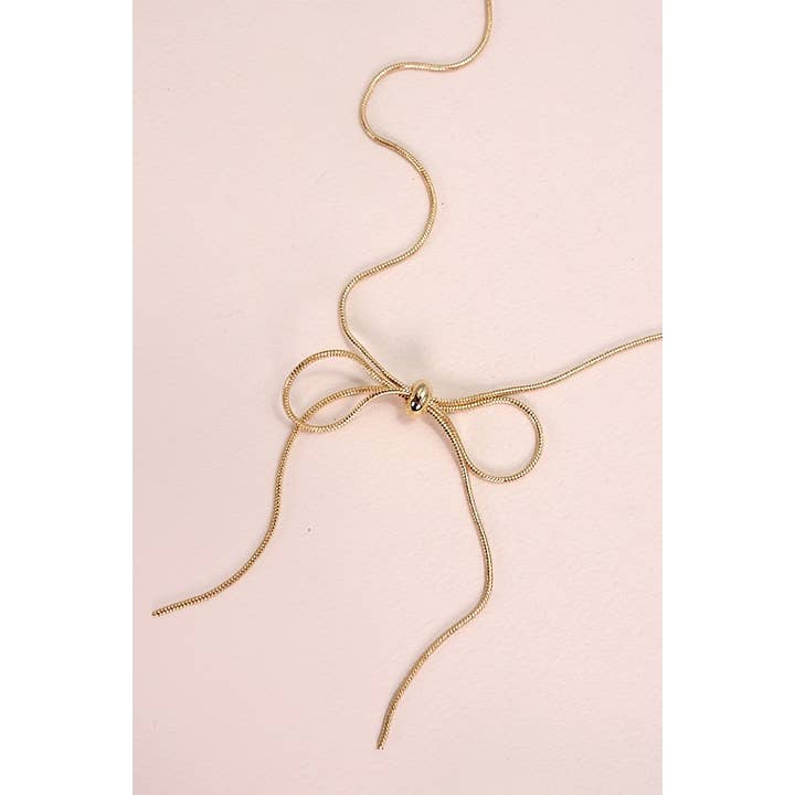 Gold SNAKE CHAIN BOW PENDANT NECKALCE | 80N815 for wholesale on Faire