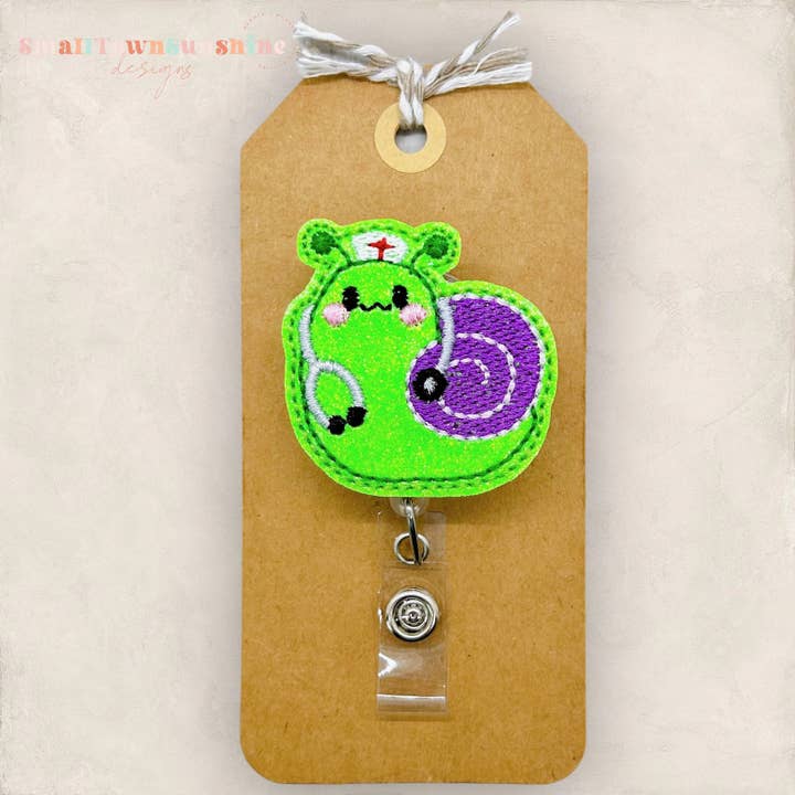 Nurse Snail Badge Reel for wholesale by The SmallTownSunshine Company