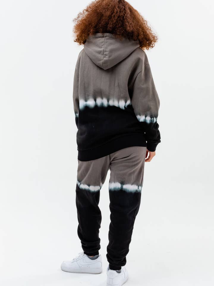 CONTINU8 JOGGINGHOSE MIT GRAUEM PRINT für den Großhandel von Continu8