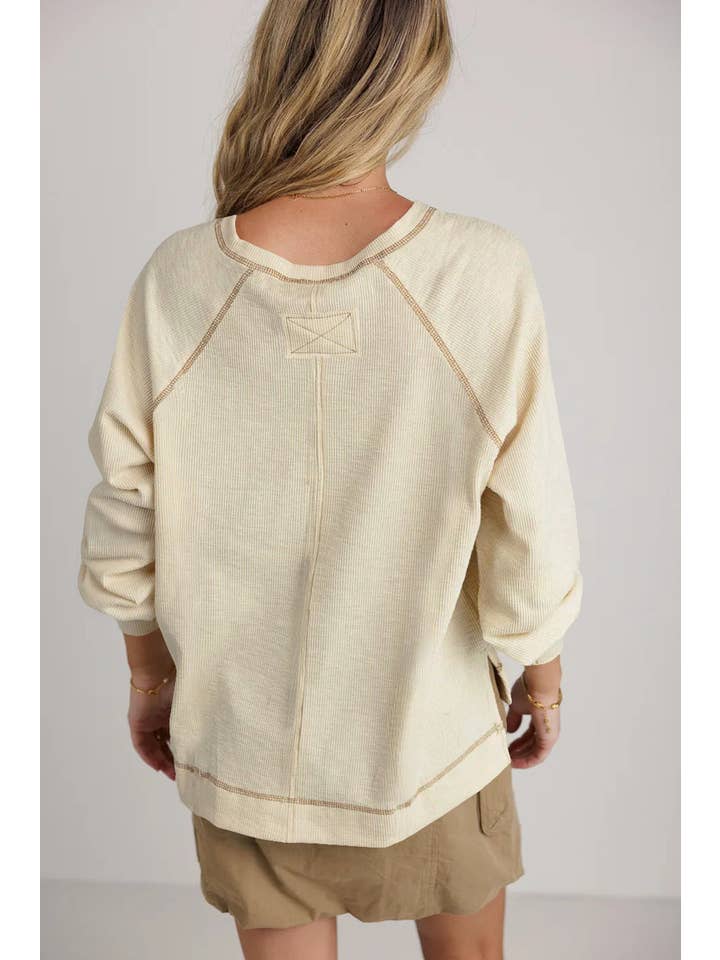 Beige Exposed Seam Textured Knit V Neck Pullover Top for wholesale on Faire