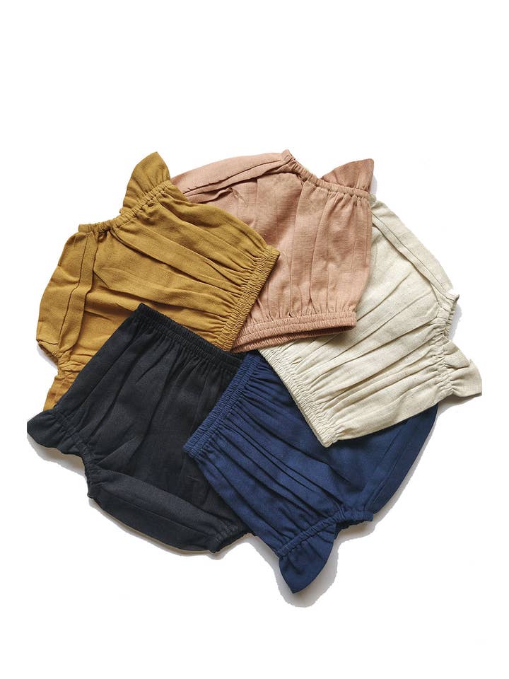 Juego de 5 fundas para pañales con alas en color marfil, azul marino, negro, camel y rubor para venta al por mayor de Yo Baby