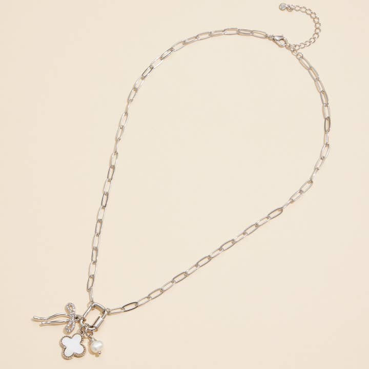 Gold Dipped Bow Charm Necklace with Clover and Pearl for wholesale on Faire4