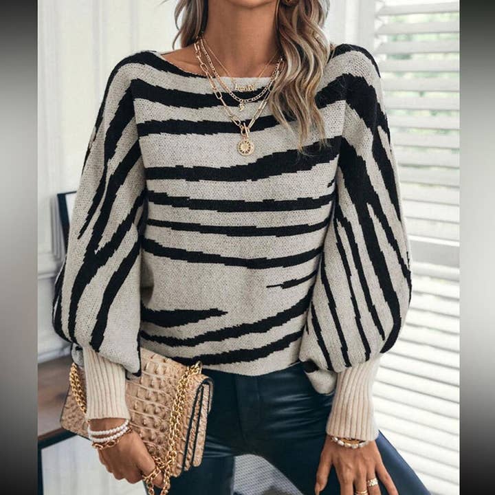 Sweater with Bold Zebra Stripe Pattern & Balloon Sleeves and other Purchase Wholesale zebra top. Free Returns & Net 60 Terms on Faire trending on Faire.