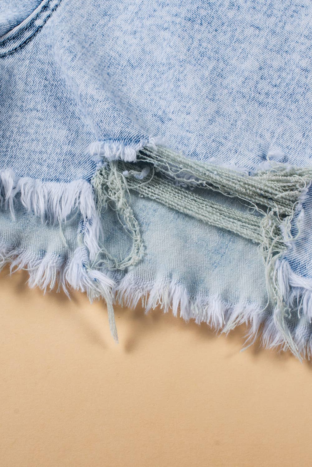 Light Blue Acid Wash Crossed Raw Edge Denim Shorts for wholesale on Faire4