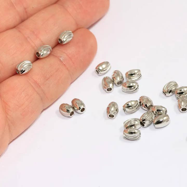 5x6mm Rhodium Plated Ball Beads, Oval Faceted Beads, BRT637 for wholesale by QueenJewelryM