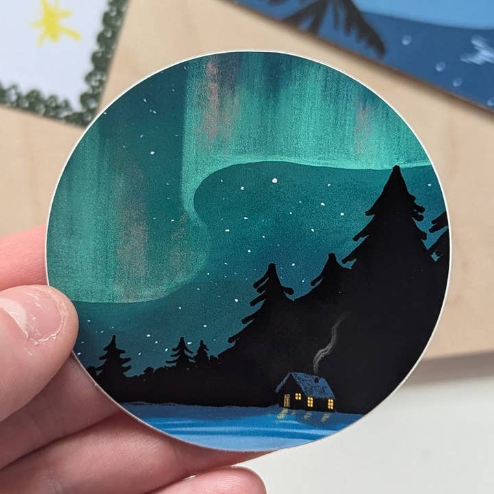 Northern Lights Cabin Illustrated Vinyl Sticker for wholesale by Charis Raine Illustration