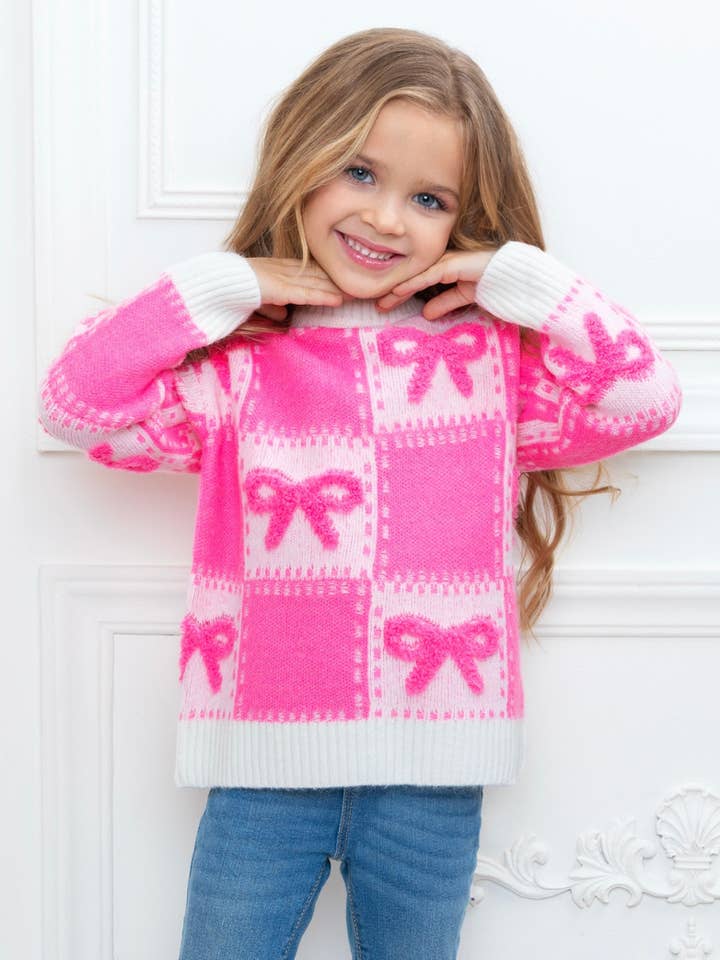 Sød lyserød ternet strikketrøje med sløjfe for engroshandel hos Mia Belle Girls • Wholesale