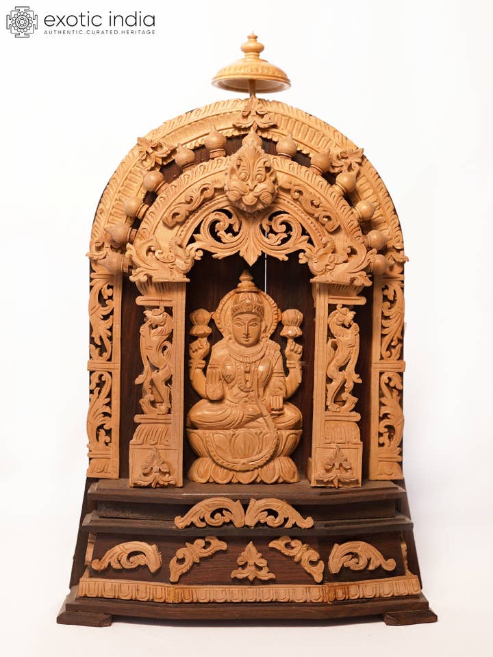 11" Sandalwood Carved Temple Design Goddess Lakshmi Statue for wholesale by Exotic India Art