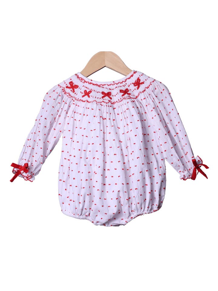 Swiss Dot Bubble met gesmokte rode strik voor wholesale door The Smocked Flamingo