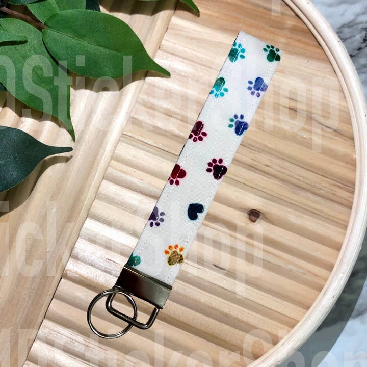 Färgglada tassavtryck på vit tyghandledsrem, nyckelband för wholesale av MDStickerShop