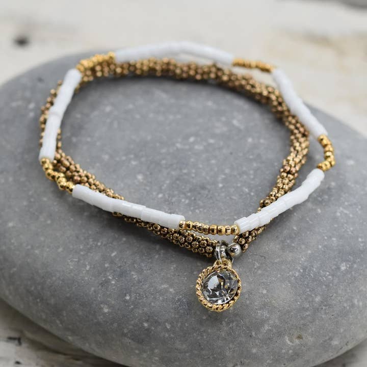 Stretchy bracelet duo in white and gold beads with crystal c for wholesale by Tempest Designs
