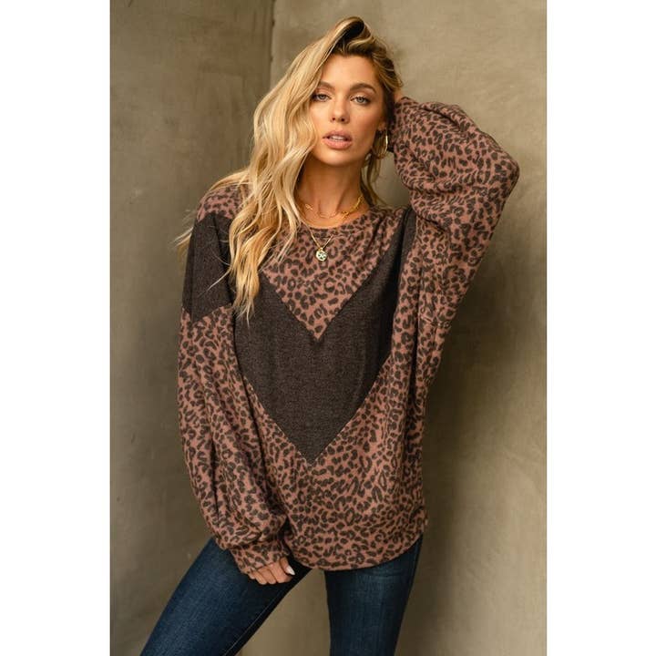 Top leopardato con maniche a bolle a zigzag per la vendita all'ingrosso da parte di Phil Love
