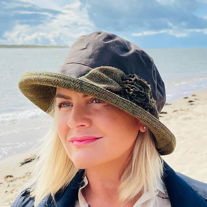 Ginette Waxed Rain Hat in Brown with British Tweed Trim for wholesale by Peak & Brim Hats