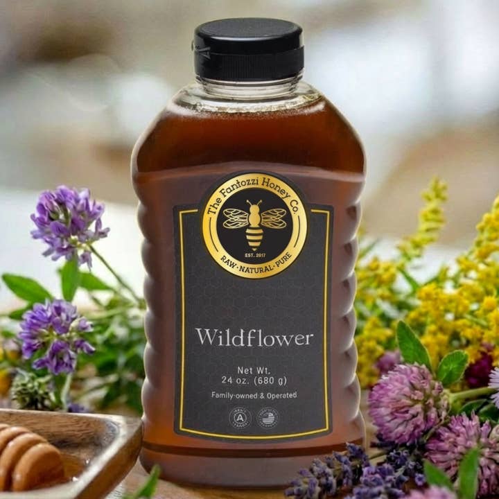 Wildflower Raw Honey Squeeze Bottle Energy Support 24oz for wholesale by Fantozzi Honey Company