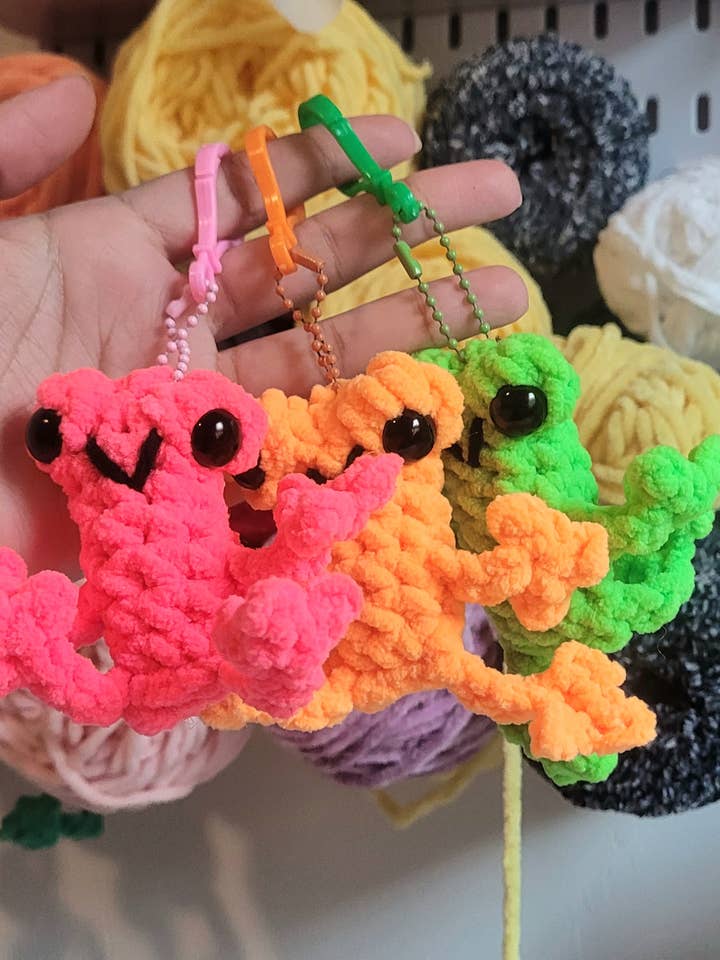 Mini leggy frog Plushy. Crochet frog keychain. for wholesale by Beyond Threads by Angelis