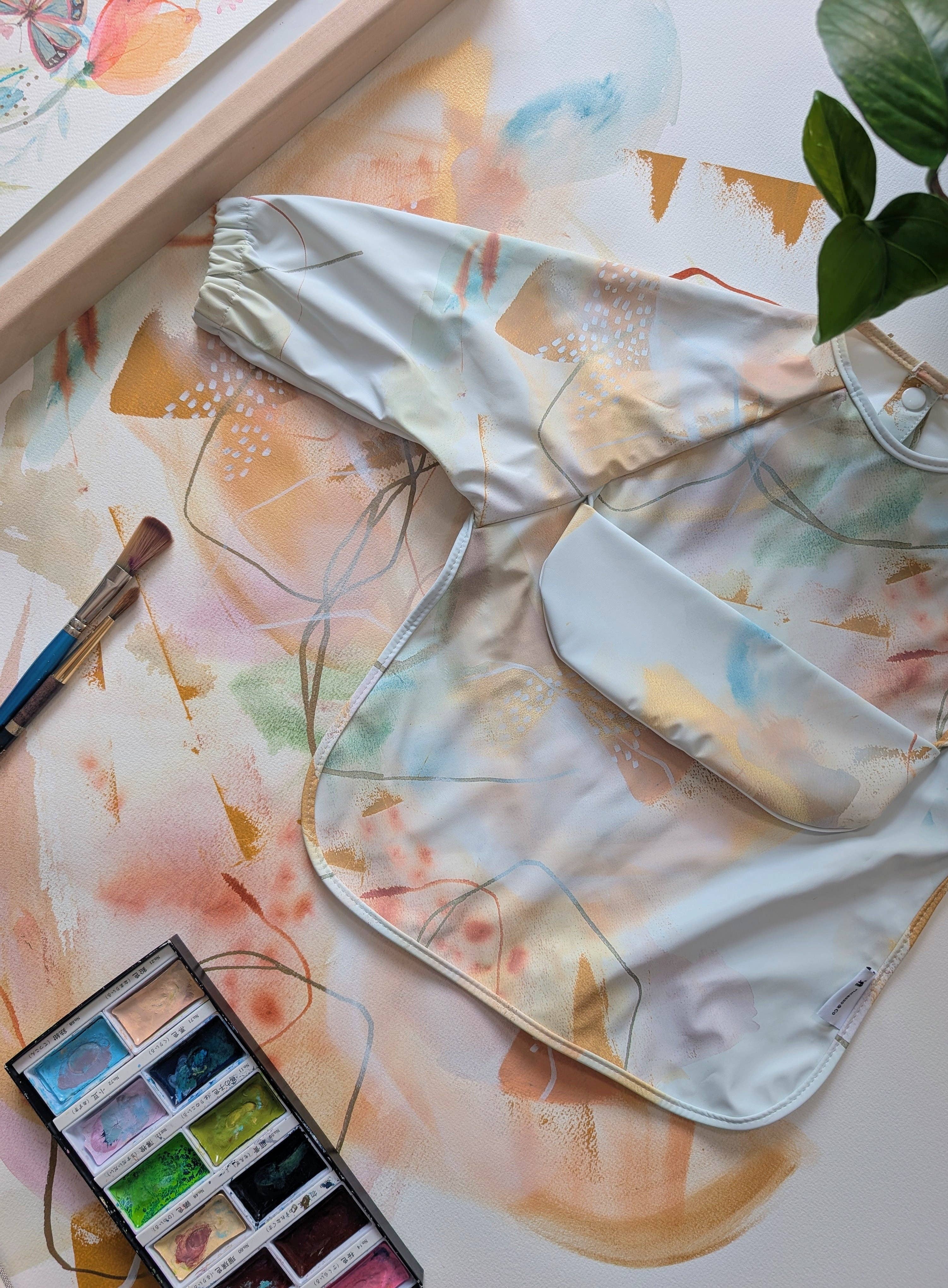 Micasso & Co - Wholesale Apron - Kids - Long-sleeve bib with integrated pocket0