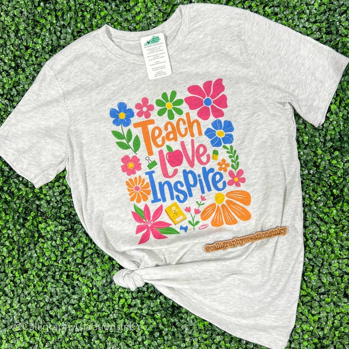 Floral Teach Love Inspire Tee for wholesale by Calligraphy Creations In KY