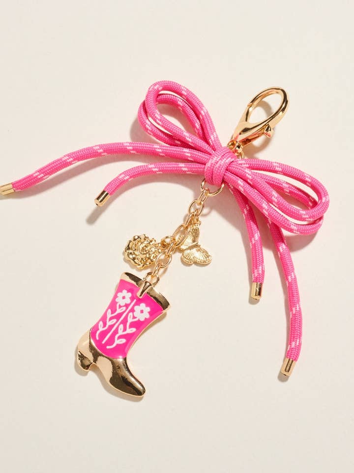 Porte-clés de sac botte florale de cowgirl rodeo pour la vente par Designature New York