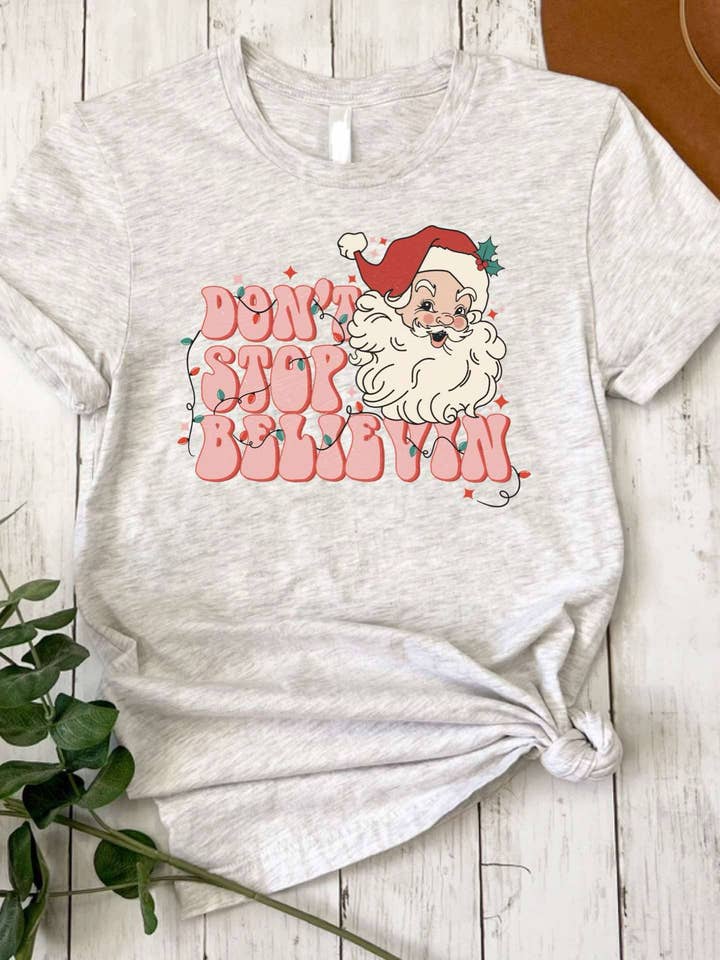 Don't Stop Believin Santa for wholesale by It's A Tee Party