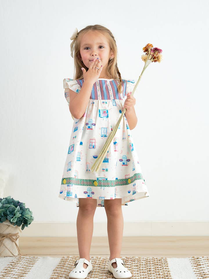 Abito con balza e balconcino in platino per la vendita all'ingrosso da parte di Aspen Rain Boutique