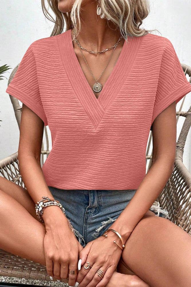 UNISHE - Venta al por mayor Jersey corto de punto - Mujer - Top de manga corta con cuello en V con textura lisa ZK158914