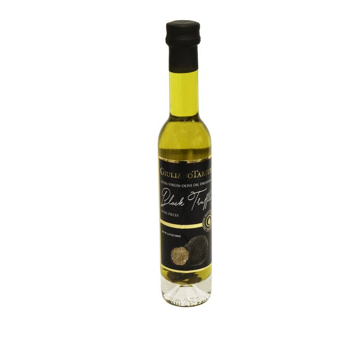 EVOO dressing – black truffle flavor 100 ml with pieces for wholesale by Giuliano Tartufi