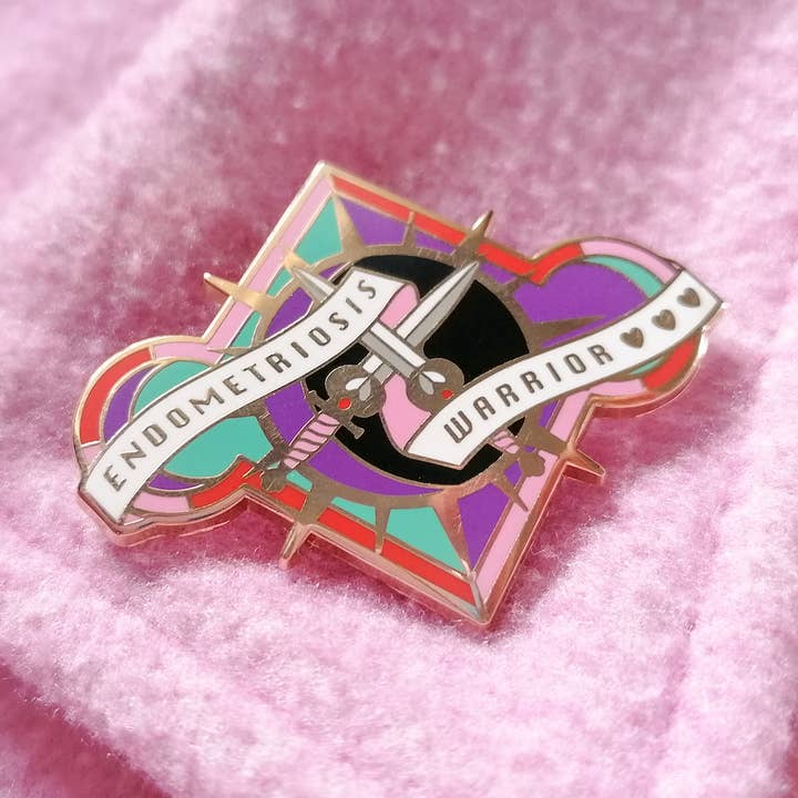Endometriosis Warrior hard-enamel pin for wholesale by Abi Stevens Illustration