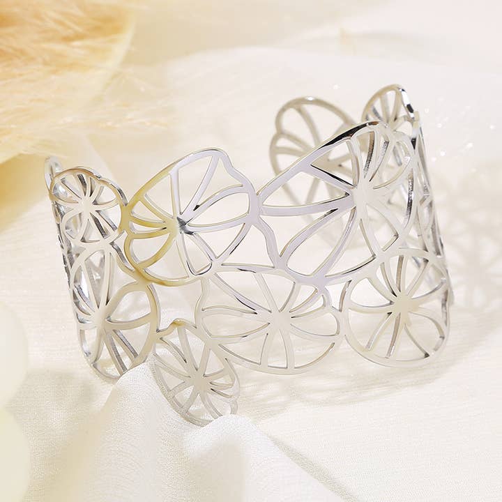 Silver cuff bracelet with openwork water lily design for wholesale by joya
