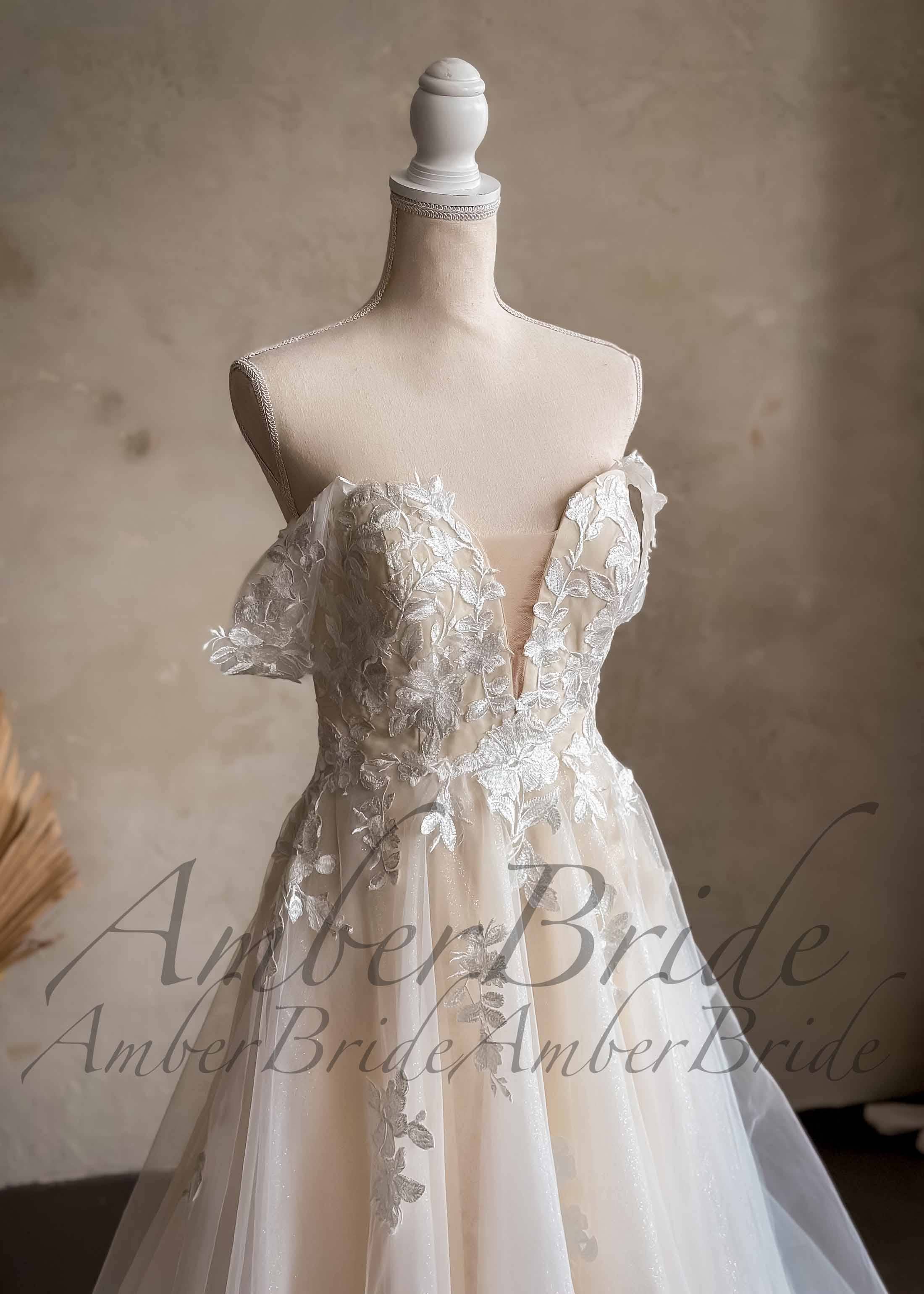Amber Commerce Group, MB - Wholesale Gown - Women's - Romantic Off-Shoulder Floral Lace Wedding Dress with A-Line Silhouette1