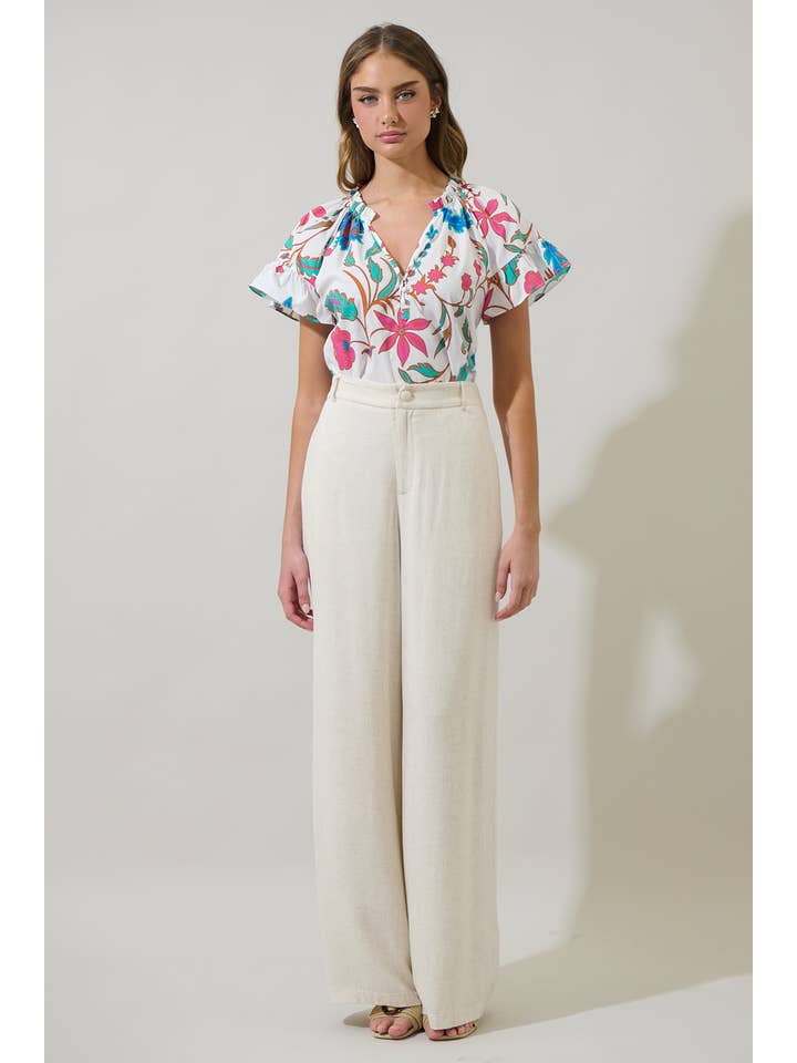 WhiteFuschia Izzie Floral Macy Ruffle Top for wholesale on Faire