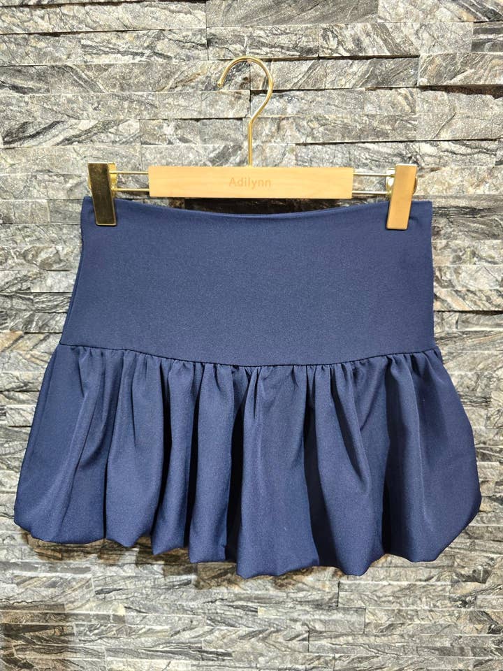 Short balloon-cut skirt, pleated, side zip UL24276Navy for wholesale by Adilynn DAYMENTEX