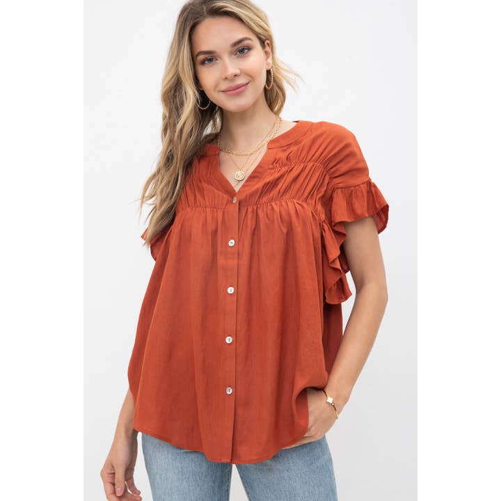 V-hals vævet top med flæserærmer for engroshandel hos Cozy Casual, Inc.