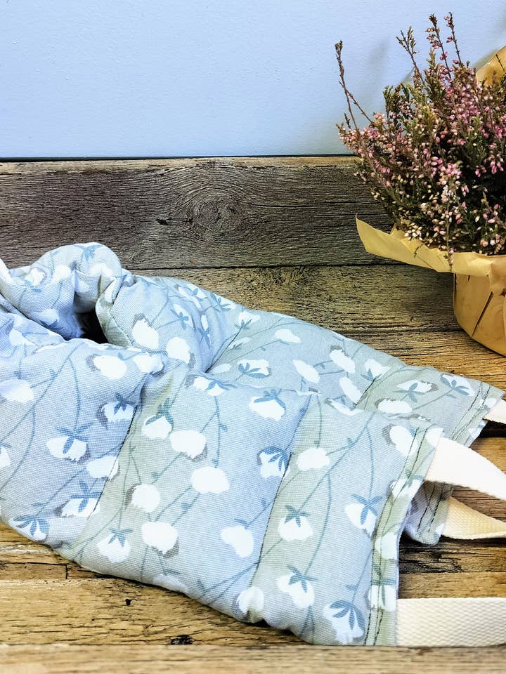 Microwavable, Rice-filled Heating Pad with Handles for wholesale by Survivors Alliance for Growth and Employment